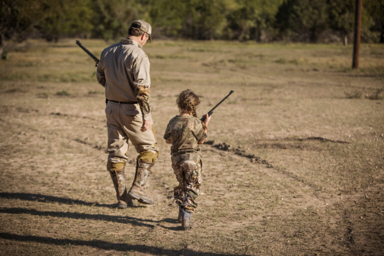 Father and daughter (6-7) hunting